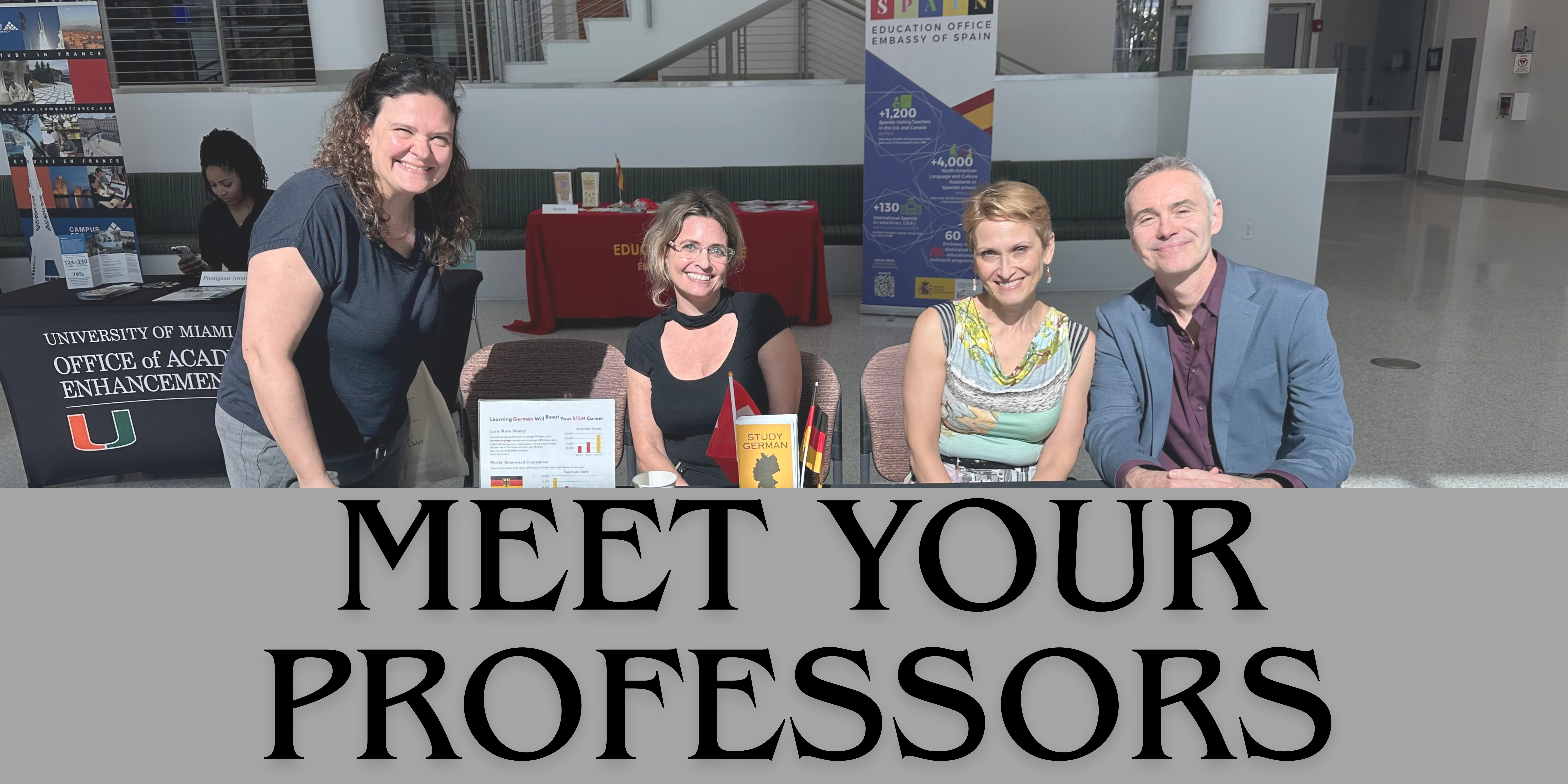 four professors sitting at the table